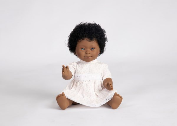 Down syndrome feature African doll with blue eye